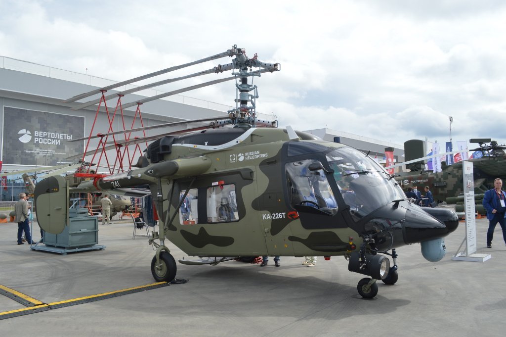 Ka-226T ‘241 White’ with folding rotors, searchlight and EO surveillance system. The helicopter has an identity crisis, being painted in civilian colours on the port side!