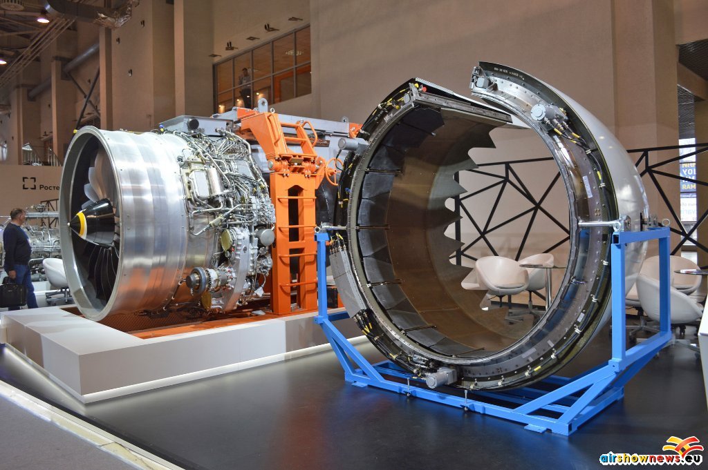 A PD-14 engine on a ground handling dolly, with the thrust reverser assembly in the foreground